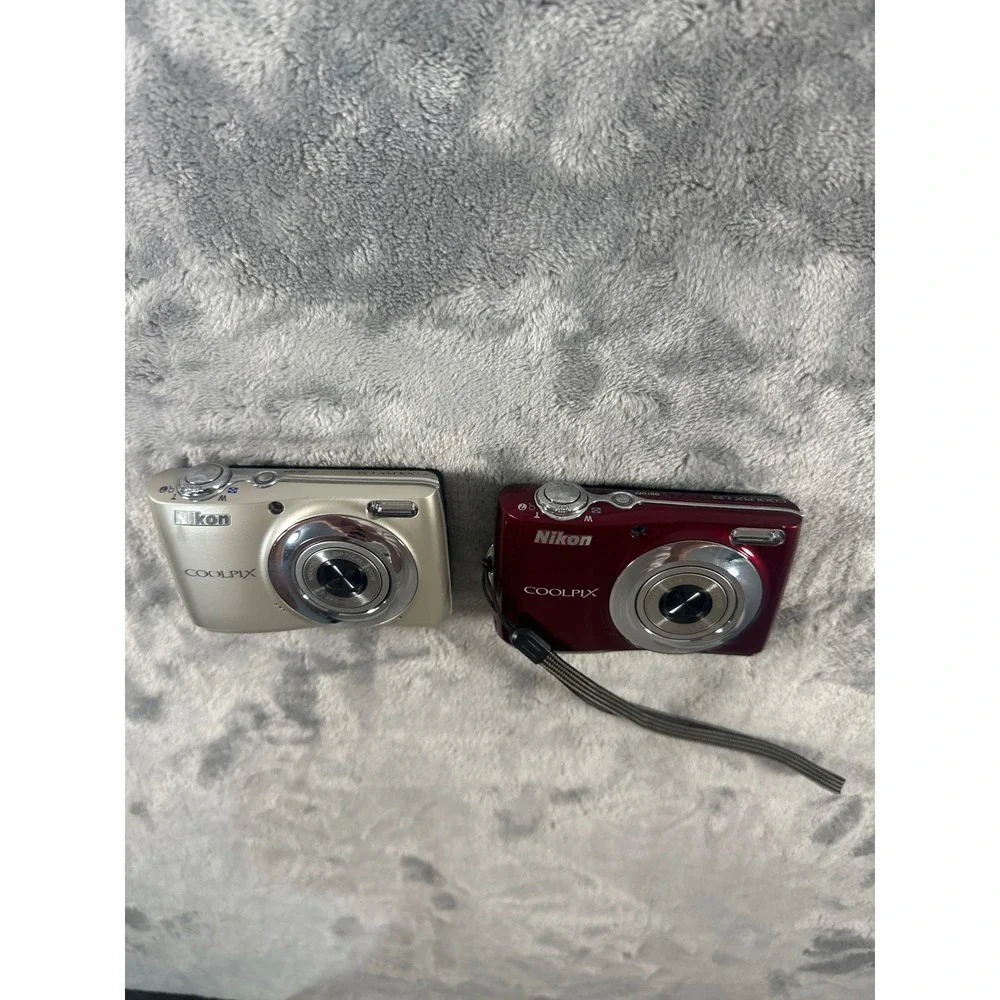 Two Nikon Coolpix L22 Digital Cameras faulty battery cover on both PARTS ONLY